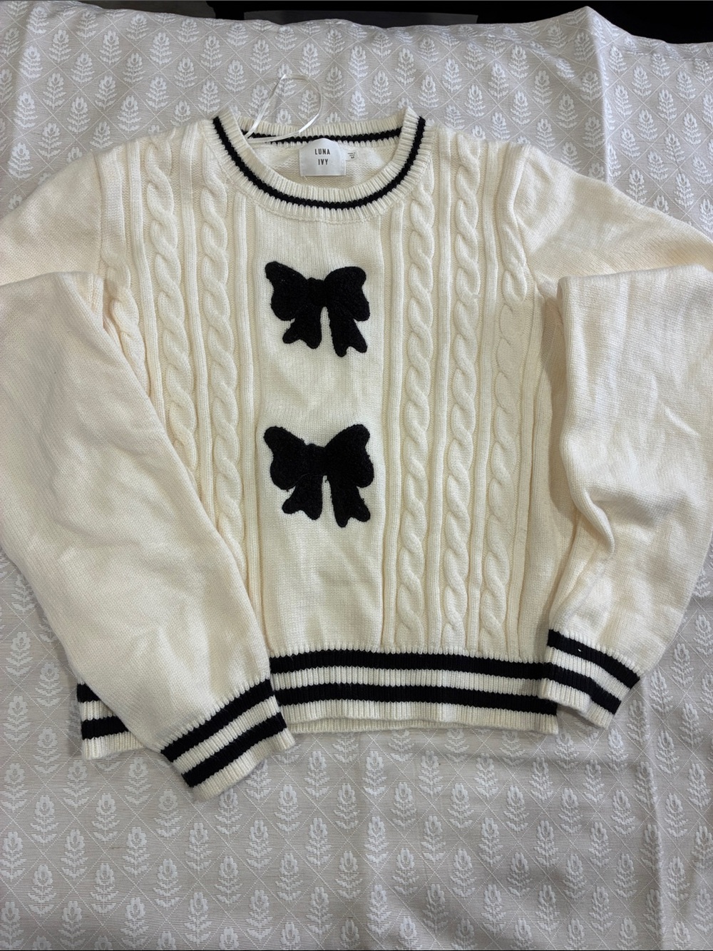 Luna Ivy Cream Bow Cable-Knit Crewneck Sweater